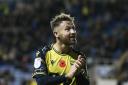 Matty Taylor applauds the home support while with Oxford United last season