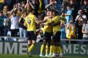 Oxford United celebrate their fifth goal against Peterborough United