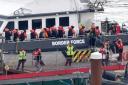 A group of people thought to be migrants are brought in to Dover, Kent, from a Border Force vessel following a small boat incident in the Channel (Gareth Fuller/PA)