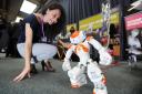 Brenda Romino, from Oxford Brookes University, demonstrating Robbie the robot at Venturefest Oxford in 2016. Picture Jon Lewis