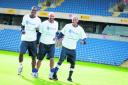 Liam Davis, Wayne Brown and Damian Batt of Oxford United show their support for World Mental Health Day