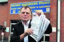 MP Andrew Smith with copies of his survey at the Oxford Stadium