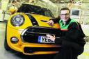 Tom Bradford, Mini body shop production manager with the award-winning model. Picture: OX68654 Mark Hemsworth