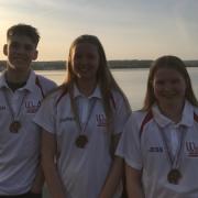 Witney swimmers (from left) Reuben Coppuck, Lauren Mellings and Jess Miller with their medals