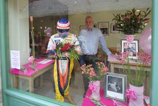 A dummy of F1 driver Fernando Alonso - BUT hold on thats TECHNICAL DIRECTOR DR PAT SYMONDS of RENALUT F1 in the flower shop!