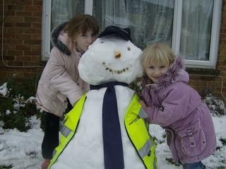 Laura (8) and Ellie (4) Brown with their snowman of their daddy who managed to get to work in Stagecoach Oxford yesterday. They both go to the Blake school in Witney.