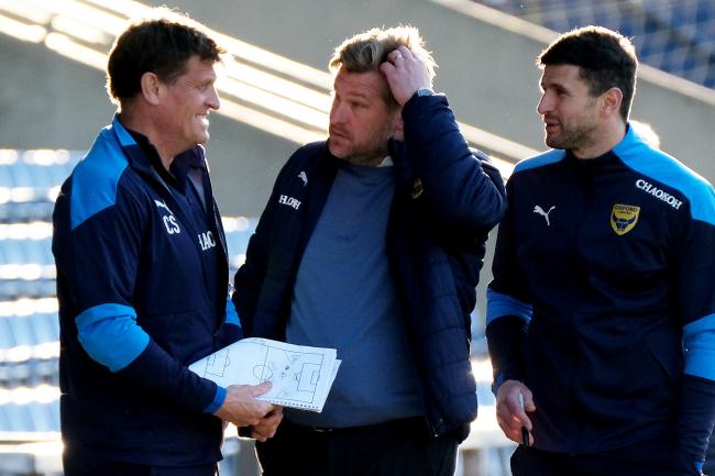 Oxford United head coach Karl Robinson, flanked by Craig Short (left) and John Mousinho (right) Picture: Ric Mellis