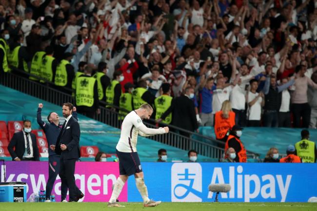 England fans celebrate after the semi-final win over Denmark Picture: Nick Potts/PA Wire
