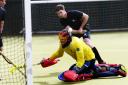 Witney goalscorer Ben Moss has a shot saved in unorthodox fashion during their 2-2 draw with Reading 2nd   Picture: Ed Nix