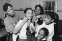 Charolette Fadipe, left, gives drama lessons at Roots drop-in centre in Oxford in 1986 to Maxine Charlett, 10, Fay Jones and Natasha Adams, both 13 – can anyone name the girl in front? Meanwhile below, members take part in a 10-mile sponsored run