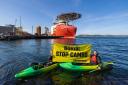 Greenpeace Norway activists in kayaks confront Siem Day loading drilling infrastructure for the Cambo oil field on behalf of Siccar Point Energy and Shell Oil, at Randaberg Industries, outside Stavanger, Norway..