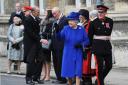 The Queen distributes Maundy money on a visit to Christ Church Cathedral in 2013