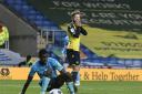 Matty Taylor sees his shot rebound off the post against Exeter City. Picture: David Fleming