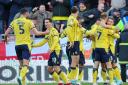Oxford United players celebrate at Leyton Orient