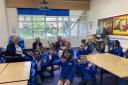 Pauline, Theo and Megan meeting the pupils at Our Lady of Lourdes Primary School