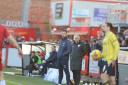 Oxford United boss Des Buckingham watches on at Cheltenham Town