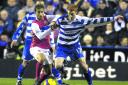 Reading's Dave Kitson (right) and Arsenal's Mathieu Flamini in action during the Barclays Premier League match