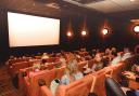 Plush sofas and armchairs in one of the screening rooms