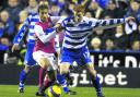 Reading's Dave Kitson (right) and Arsenal's Mathieu Flamini in action during the Barclays Premier League match