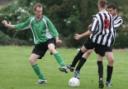 BATTLE: Combe's Matt Baker (left) challenges Chippy Swifts' Liam Fudge during his side's 4-2 victory in the Fred Ford Cup