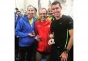 ALL SMILES: Witner runners (from left) Lindsey Smith, Tony Lock and Tegs Jones with their prizes from the Headington 5 Picture: Regina Lally