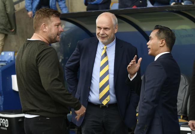 Oxford United head coach Karl Robinson with board members Horst Geicke (centre) and Anindya Bakrie (right) Picture: David Fleming