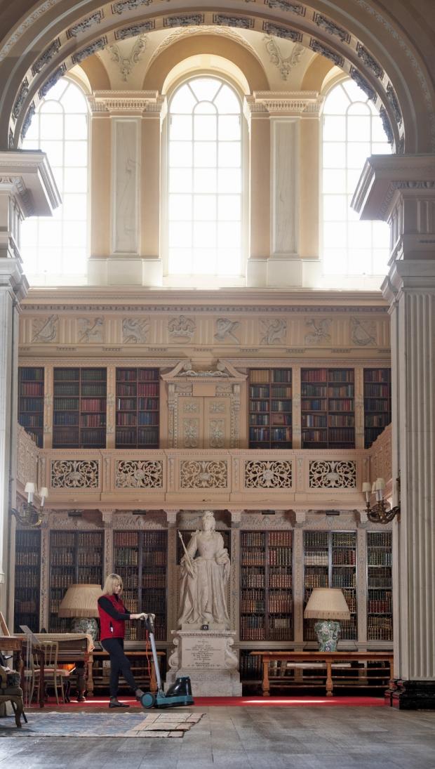 Witney Gazette: Sonia Serna working under the watchful eye of Queen Ann in the Long Library at Blenheim Palace