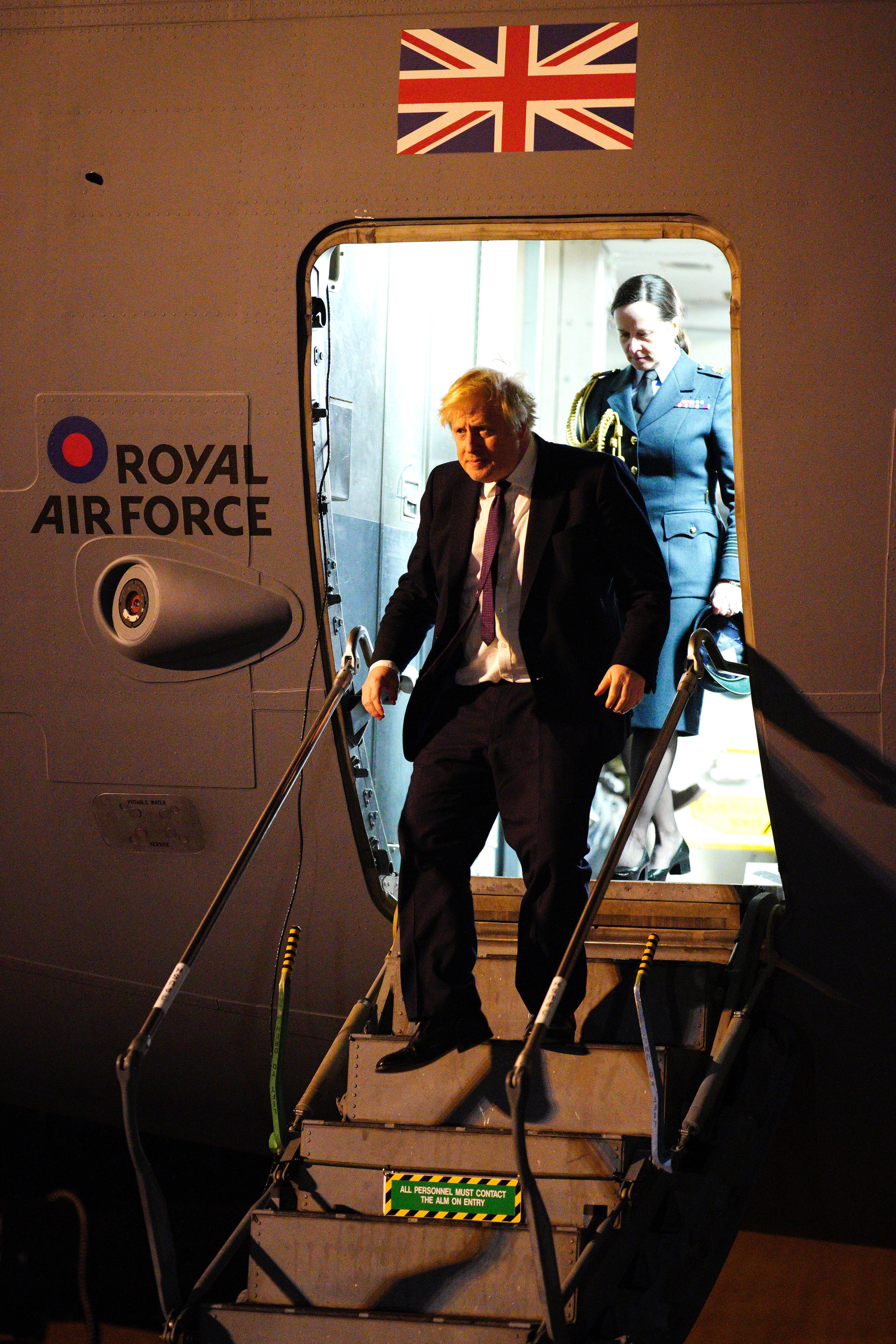 Prime Minister Boris Johnson disembarks a plane as he meets military personnel at RAF Brize Norton in Oxfordshire Picture: Ben Birchall/PA Wire 