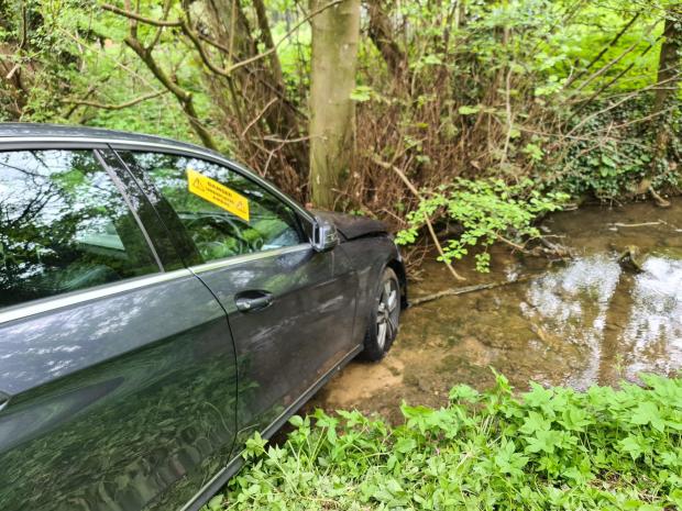 Witney Gazette: Firefighters attended a car which ended up in a river, in Swerford. Picture: Oxfordshire Fire and Rescue Service