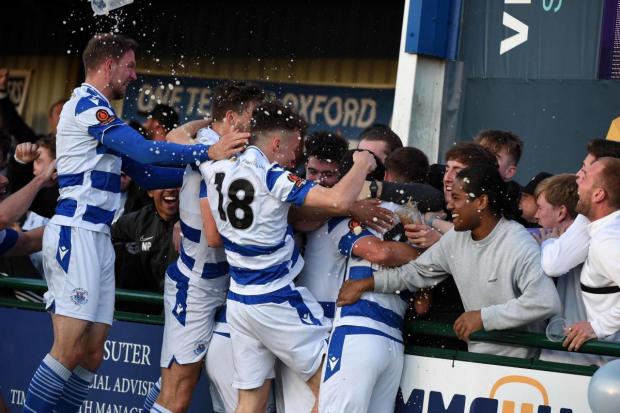Oxford City players and fans mob Elliot Benyon after his opener against Eastbourne Borough. Picture: Mike Allen