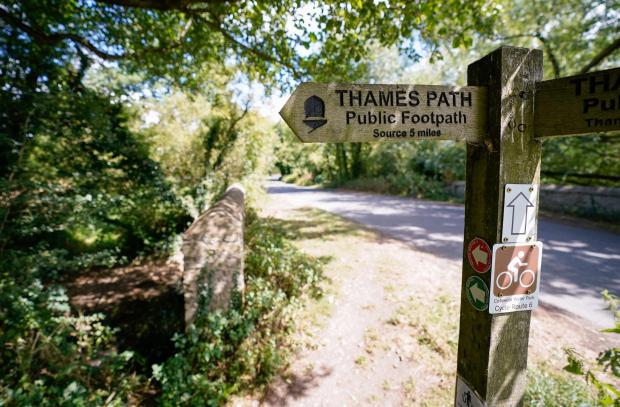 Witney Gazette: A view of a signpost for the Thames Path near to Somerford Keynes. Picture: Andrew Matthews/PA