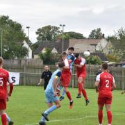 Aleks Novakovic wins a header for Ardley United in their final pre-season friendly, against Didcot Town on Saturday   Picture: Dan Reed