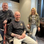 Hair professionals Leanne, Connor and Paul give out free haircuts at Oxford Railway Station to raise awareness of men’s mental health.