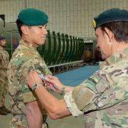 Sultan of Brunei pins parachute wings on his son at Brize Norton