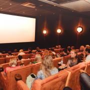 Plush sofas and armchairs in one of the screening rooms