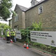 Greenpeace stage a fracking protest outside the home of David Cameron, inset, in the village of Dean in June last year. The protesters erected fencing and simulated the start of fracking activities under the Prime Minister’s house. Picture: Mark