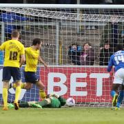 Goalkeeper Benji Buchel lies helpless on the floor as Danny Hylton clears off the line during Oxford United's 2-0 win at Carlisle United Picture: Richard Parkes