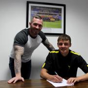 George Jeacock signs a professional deal at Oxford United as head coach Michael Appleton looks on Picture: Sarah Gooding