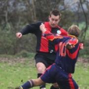 CRUNCH: Freeland's Richard Trigg tries to evade this tackle during his side's 2-1 Fred Ford Cup victory over Aston