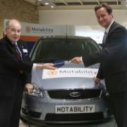 David Cameron presents the car to Bill King. 