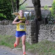 Sophie Carter, of Woodstock Harriers, heads for victory in the ladies' Mota-vation Series race at Combe Picture: Barry Cornelius
