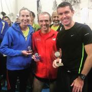 ALL SMILES: Witner runners (from left) Lindsey Smith, Tony Lock and Tegs Jones with their prizes from the Headington 5 Picture: Regina Lally