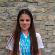 Eleanor Perks with her medals in Crawley