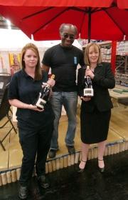 Booker store manager Michelle Guy, with customers George Smith and Victoria Gate
